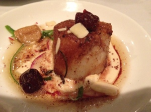 seared diver scallops with toasted almonds, braised cherries and sumac atop silken hummus
